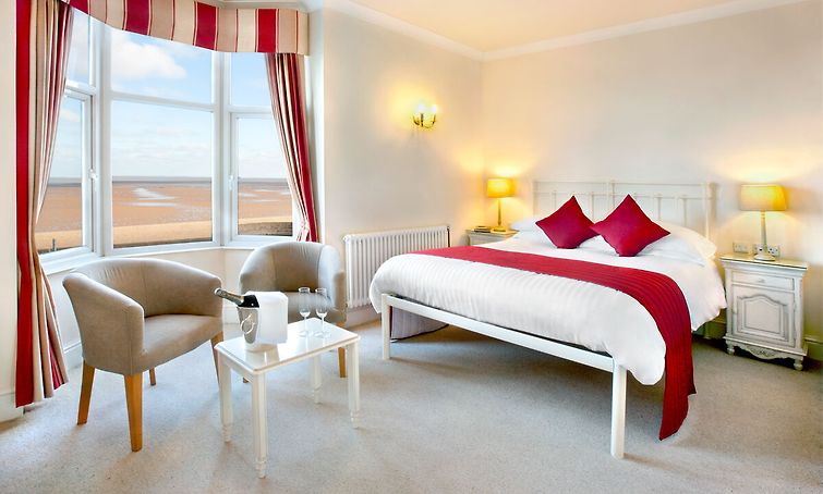 Bedroom in the kingsway hotel with a view to the beach